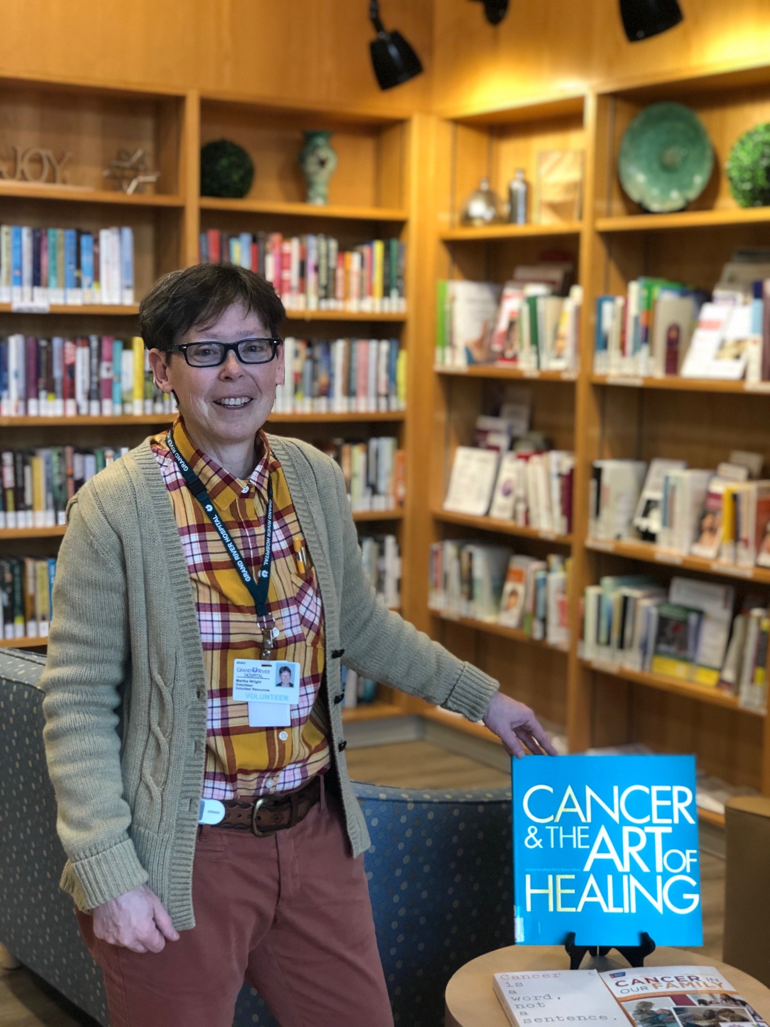 Photo of a volunteer in the resource centre